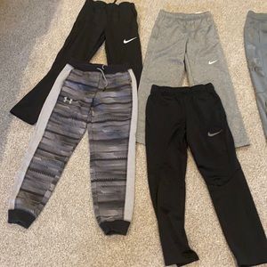 7 pairs boys Medium Nike & Under Armour pants